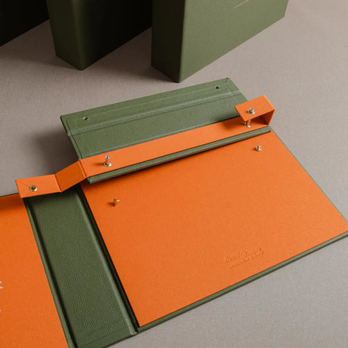 detail of leather covered swatch book with screw post