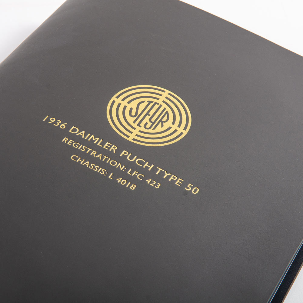 Dark grey leather folder with gold embossed text and logo on embossed into the cover - Gallery image 4
