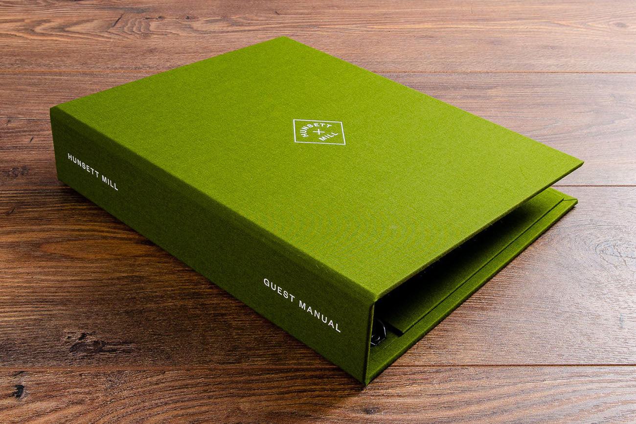 A4 custom made luxury guest information file with personalised ring binder with white foil embossing in Parana green book cloth