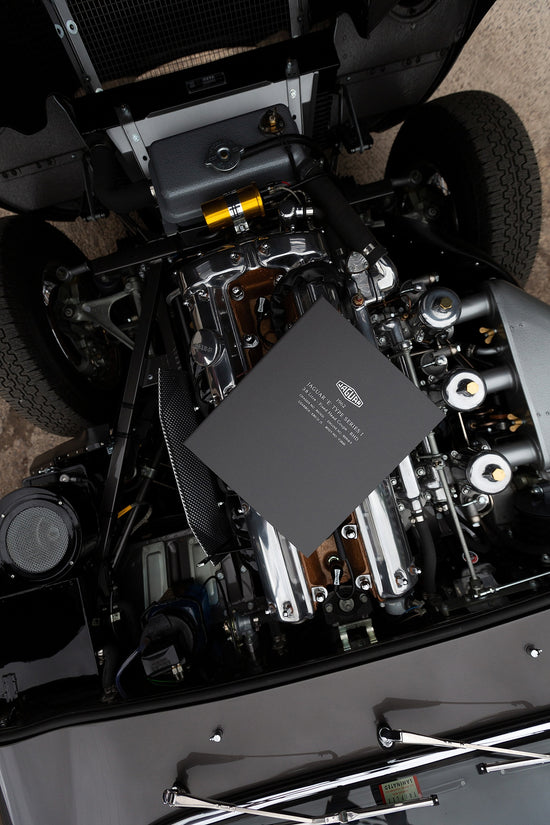 vehicle history file sitting on jaguar e-type engine