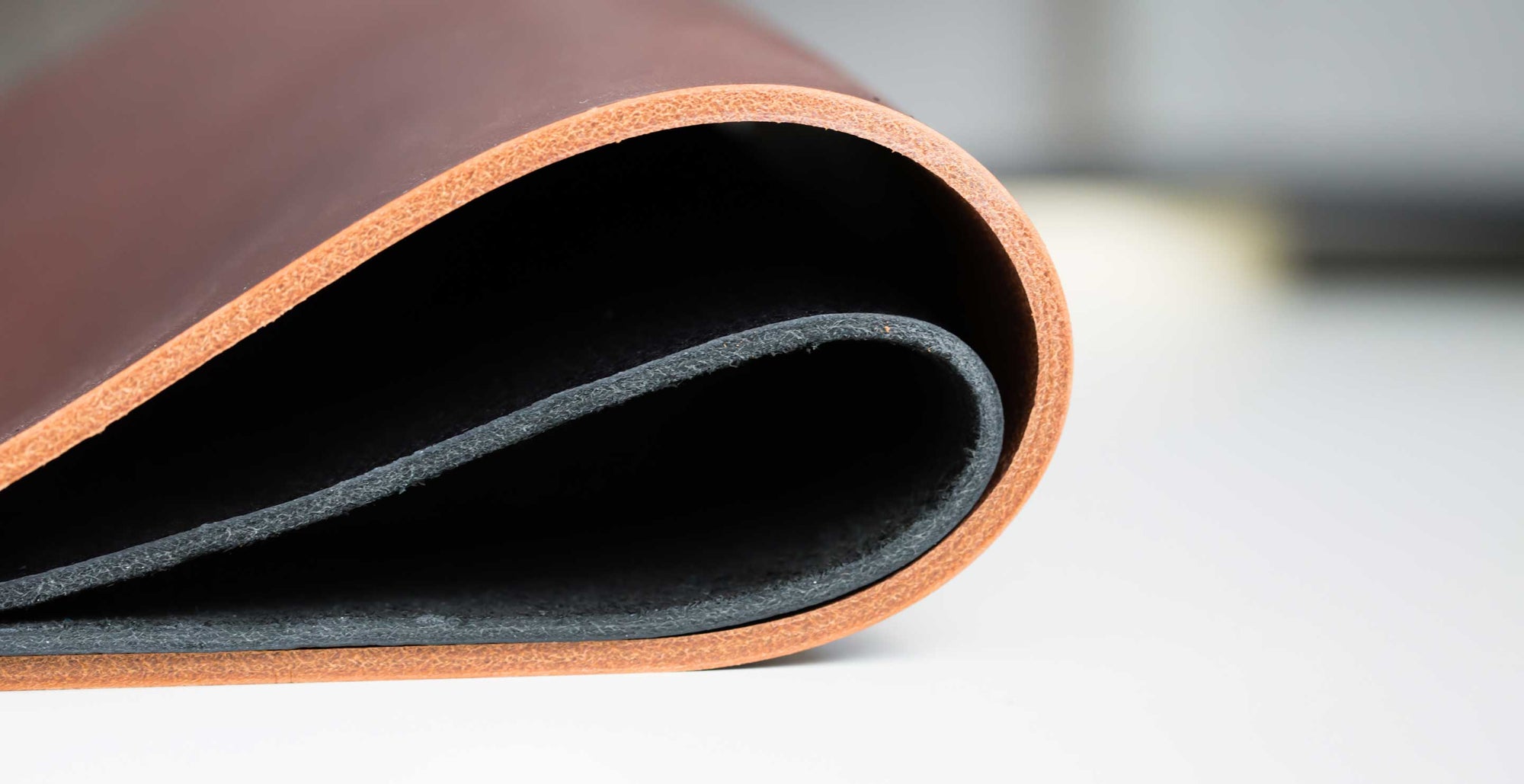 3.5mm thick brown veg tanned leather hide and 2.5mm black leather hide