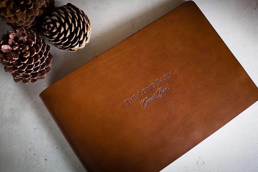 Personalised brown leather guest book with blind embossed cover