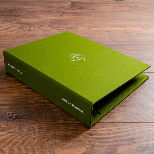 Ring binder guest information room manual for boutique hotel with personalised white foil cover