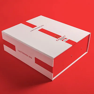 luxury personalised box file in white and red for a Lola Formula 1 cars documents and history sitting on a red background
