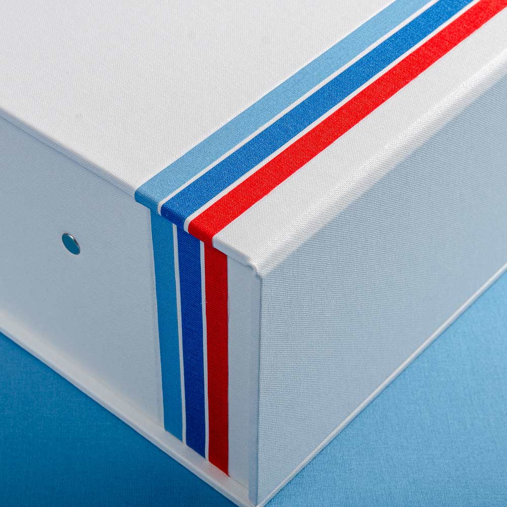 details of three fabric strips in red and blue on the cover of a custom made box file - Gallery image 2