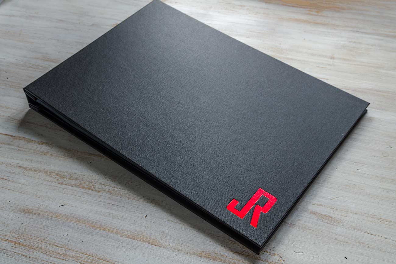 11x17 photographers portfolio with cool metallic red foiled cover