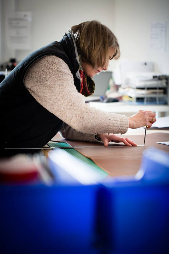 Jackie Hartnack marking out a piece of bridal leather