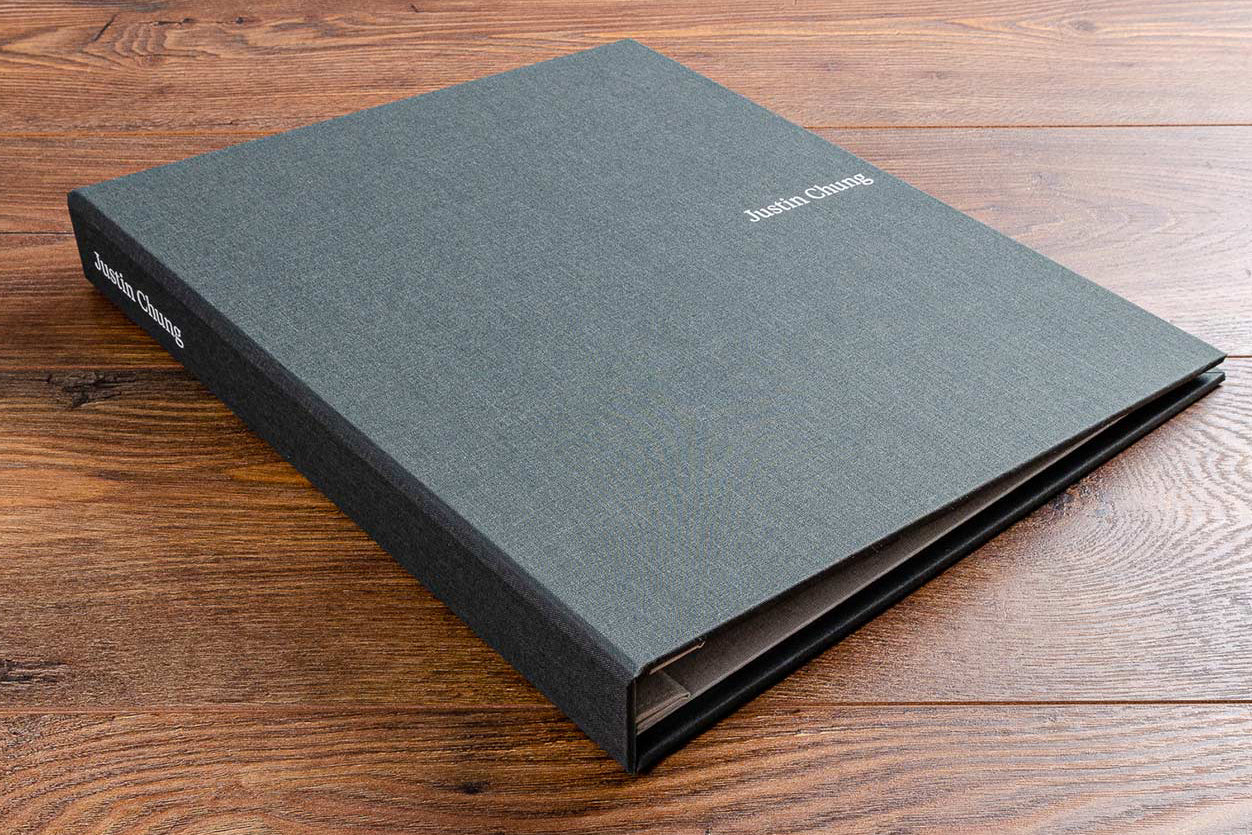 A4 custom made luxury guest information file with personalised ring binder with white foil embossing in grey book cloth