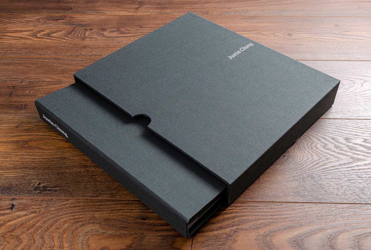 Photographers 11x14 portfolio book and slipcase with finger notches and white foil embossing