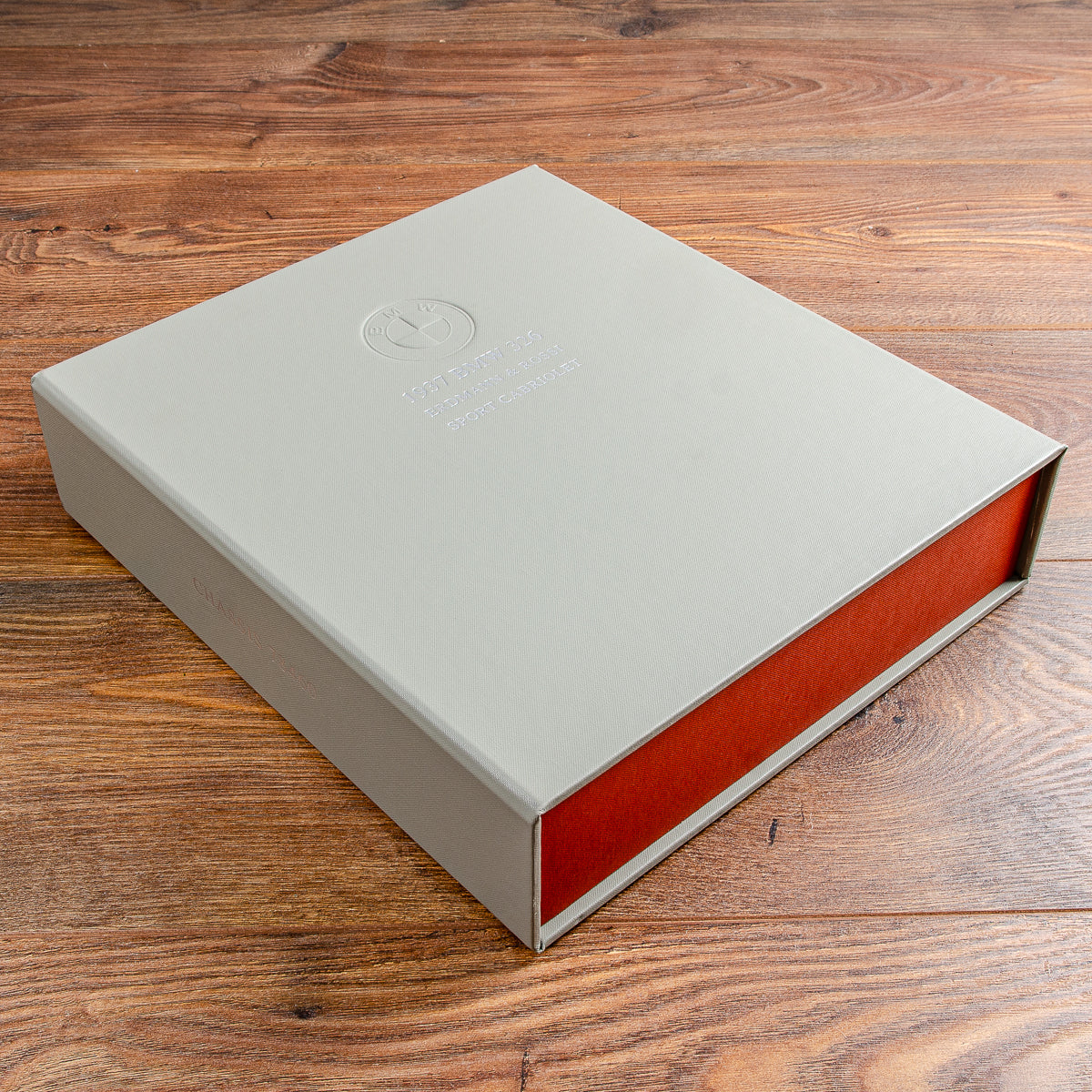 beige custom made box file with orange lined box on wooden background - Gallery image 1