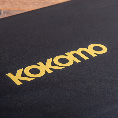 gold foil embossed logo on the cover of a leather guest book for luxury super yacht