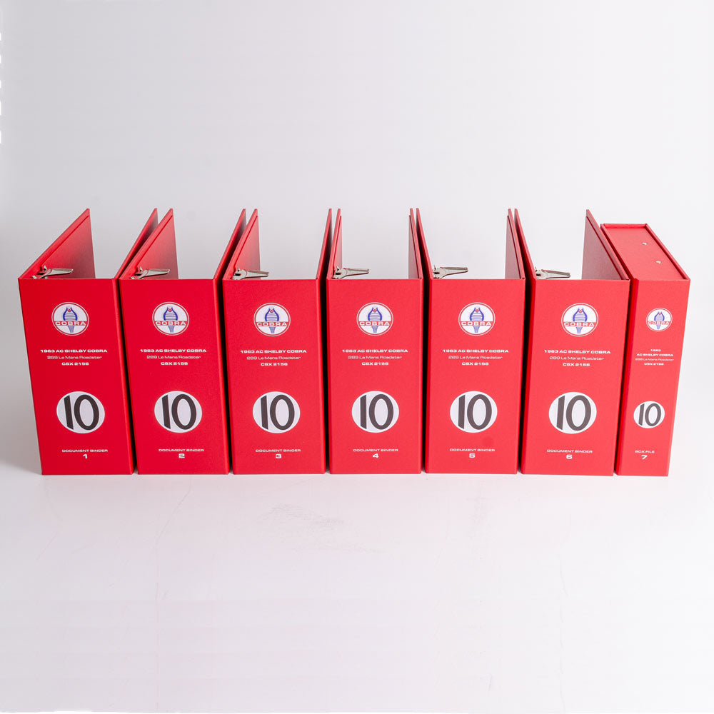 a row of large binders for the documents and history of a cobra racing car - Gallery image 1