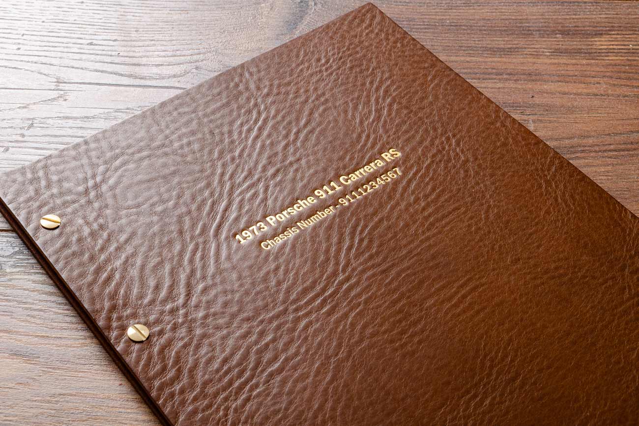 Gold foil embossed cover of leather car document binder for Porsche acr