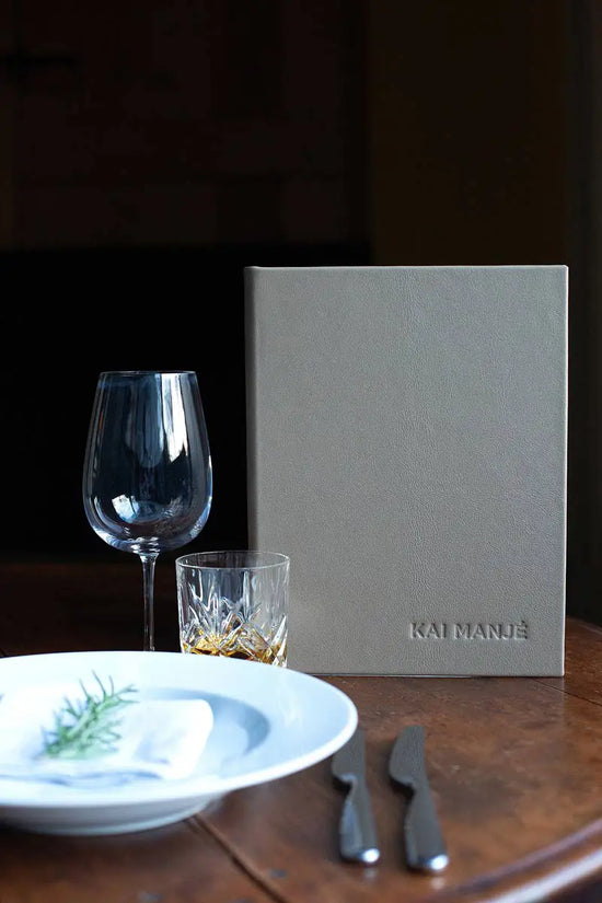 luxury leather bound menu cover with embossed logo in high end country setting