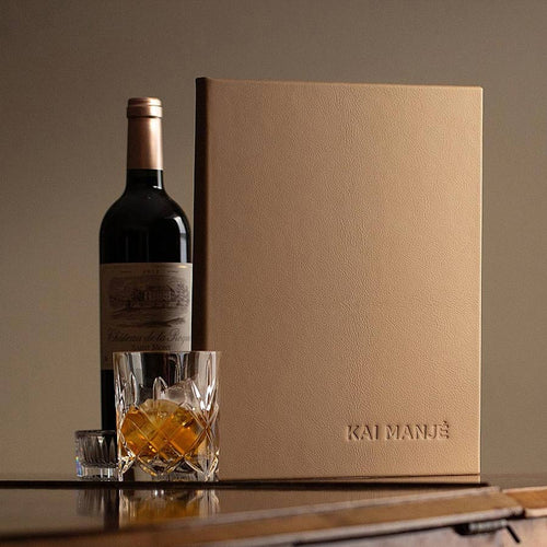 Luxury leather menu cover with embossed personalised logo on the cover with bottle of wine and whisky glass