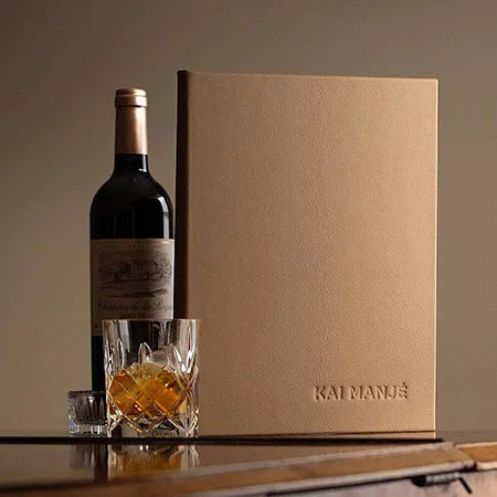 Luxury leather menu cover with embossed personalised logo on the cover with bottle of wine and whisky glass - Hospitality, Yachts, Menu Covers