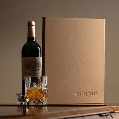 Luxury leather menu cover with embossed personalised logo on the cover with bottle of wine and whisky glass