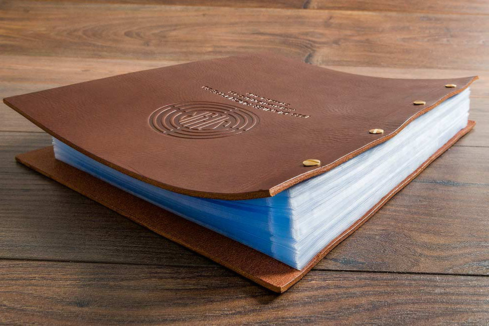 Embossed leather binder for vehicle documents
