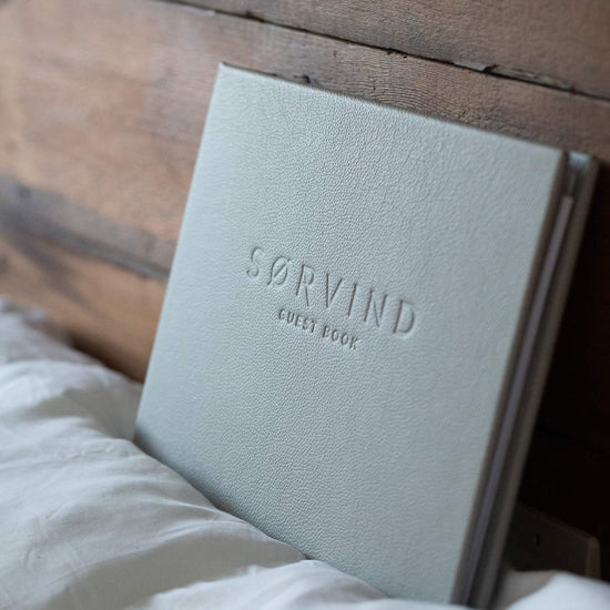 luxury leather bound guest in grey leather with embossed logo