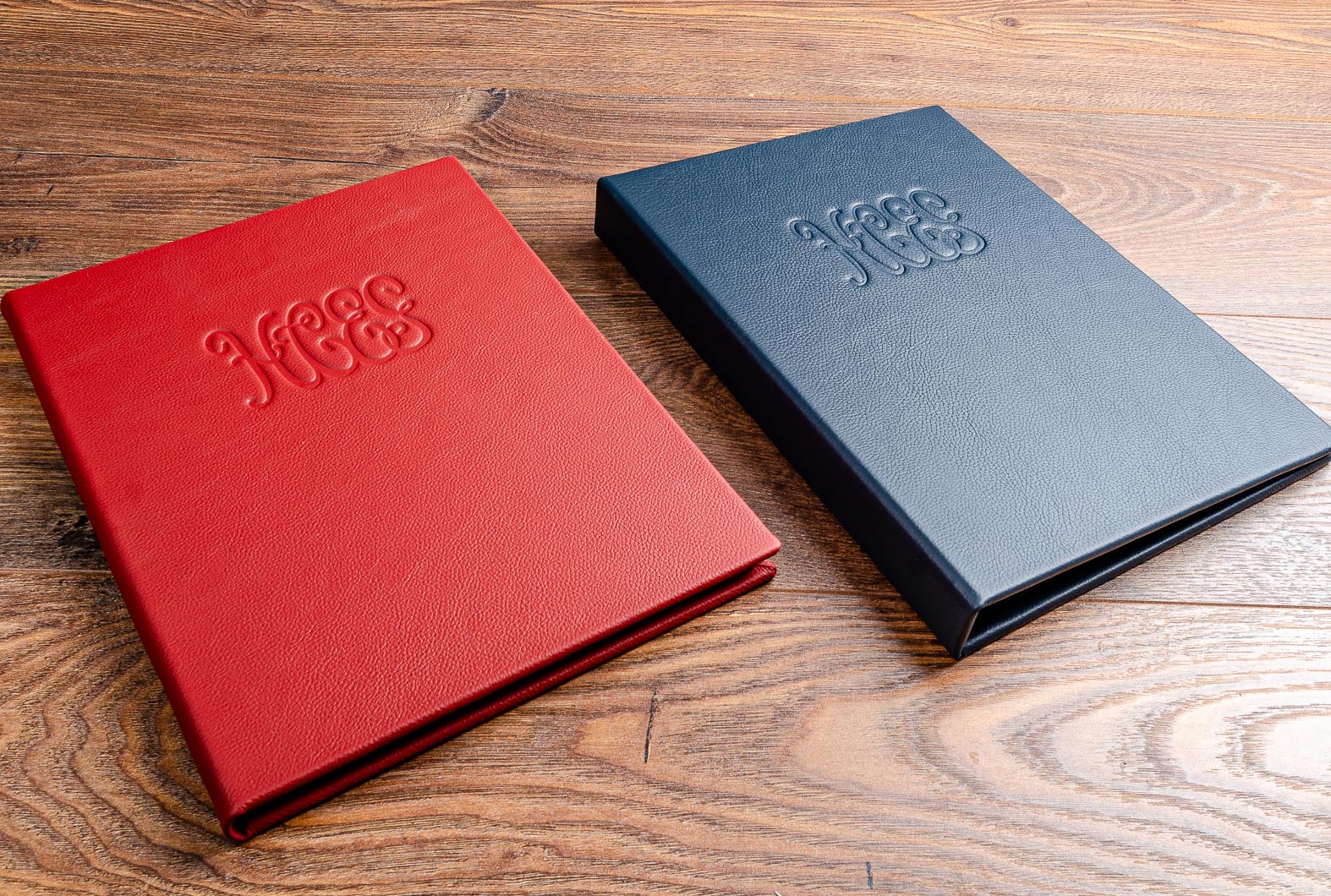 Luxury leather menu and wine list hand made and personalised with blind embossed logo 