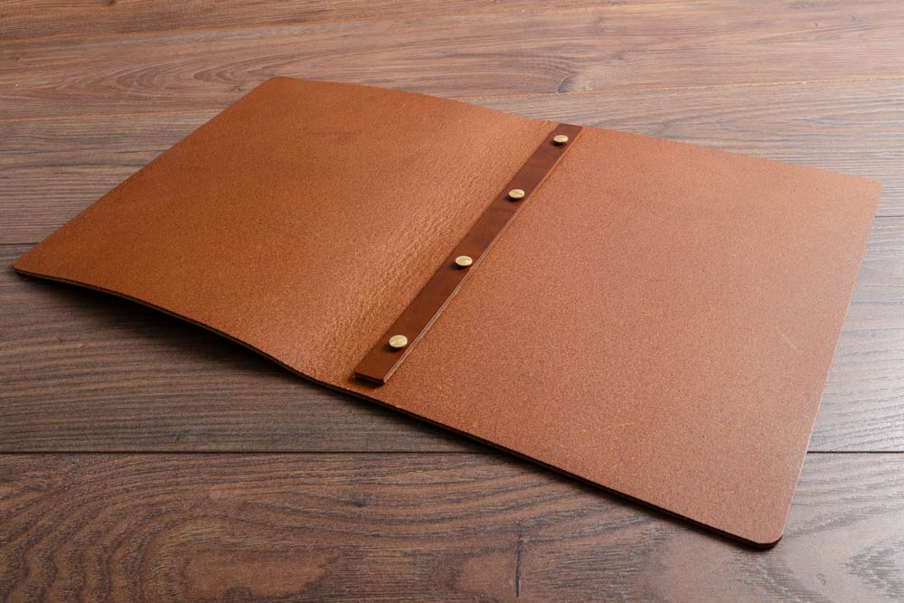 Brown leather screw post folder with brass fasteners on a wooden surface - Gallery image 2
