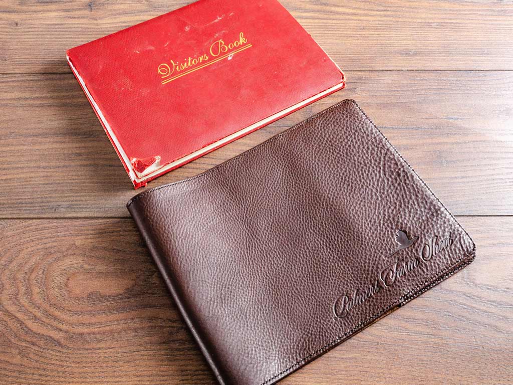 custom made bespoke and personalised leather book cover jacket for old visitors book