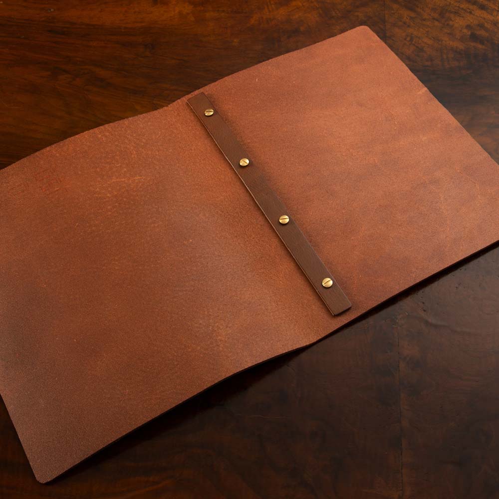 Leather Screw Post Menu in luxury veg tan leather with customizable posts for bespoke menu cover presentation.