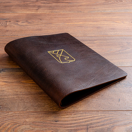 leather menu cover in 3.5mm dark brown veg tan leather with gold foil embossed logo