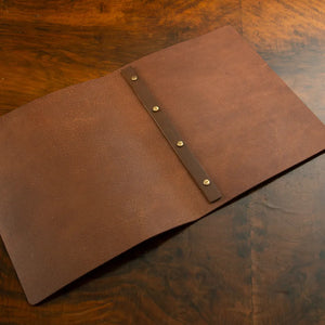 Leather Screw Post Menu in luxury veg tan leather with customizable posts for bespoke menu cover presentation.
