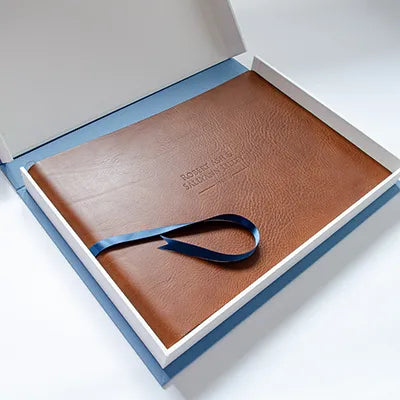 brown leather personalised embossed album in luxury white and blue clamshell box