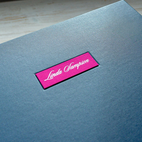Purple personalised name plaque inset into the cover of a custom made memory book
