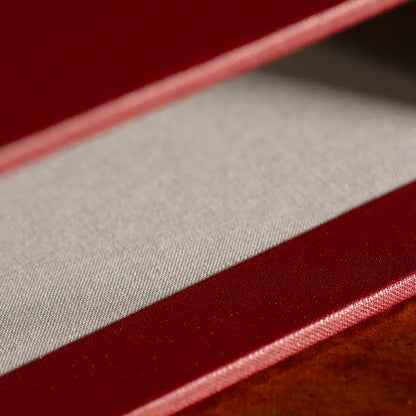 Slipcase by Hartnack and Company featuring bespoke hand-crafted fabric lining and luxury bespoke materials.