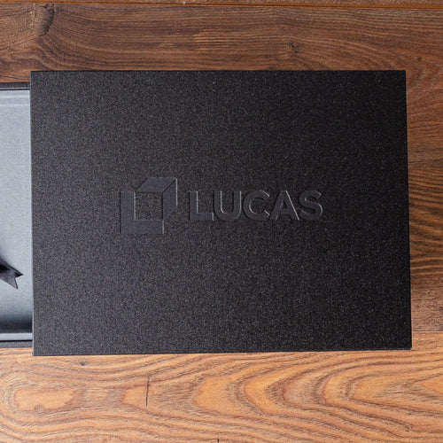 blind debossed logo stamped into the cover of a presentation box