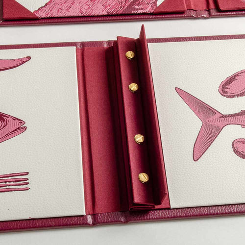 screw post menu cover with the flap open to show brass screw caps