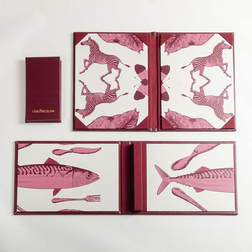 Two open menu covers in PU leather with pink animal illustrations on a white background