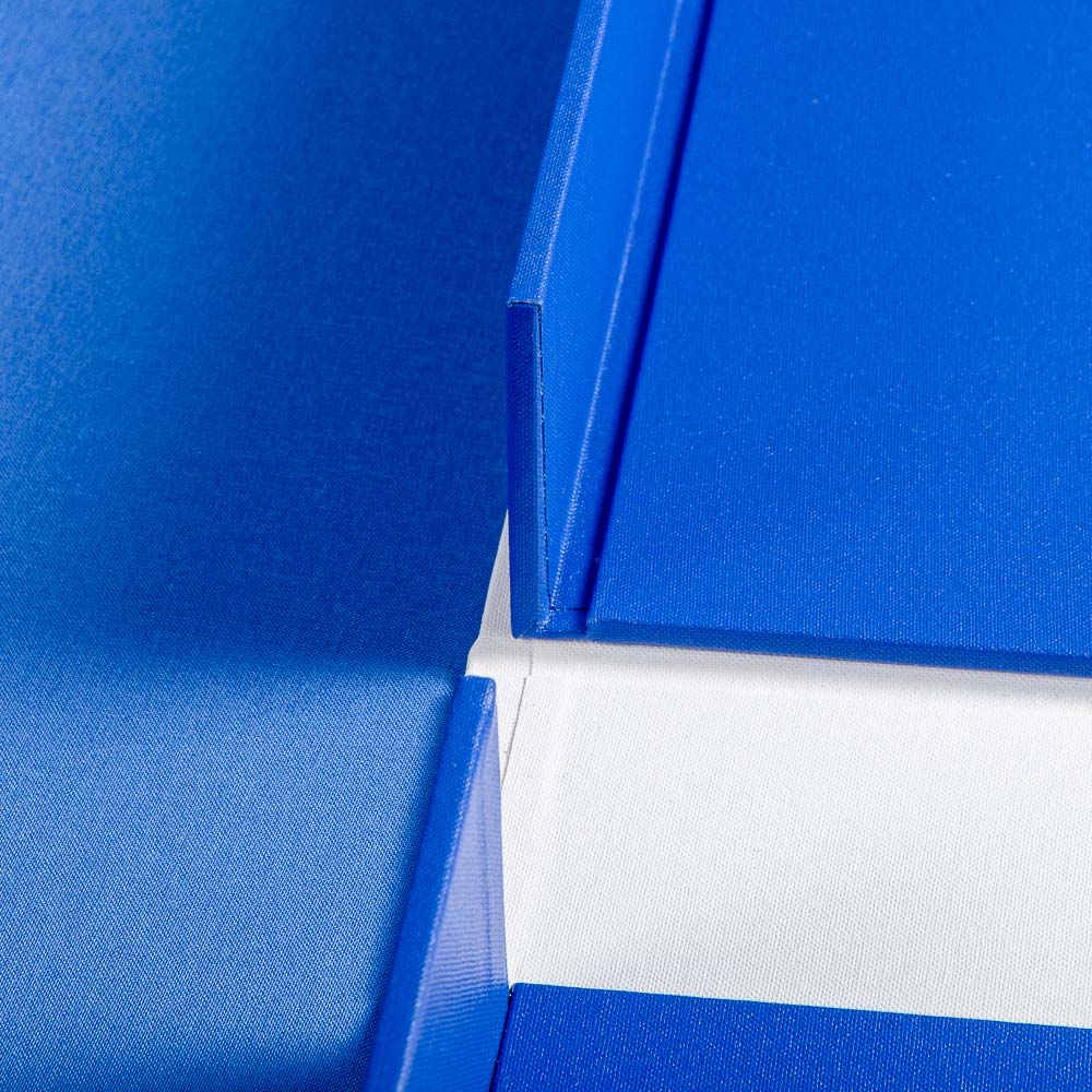 Close-up of a blue and white luxury box with a textured cover. - Gallery image 5