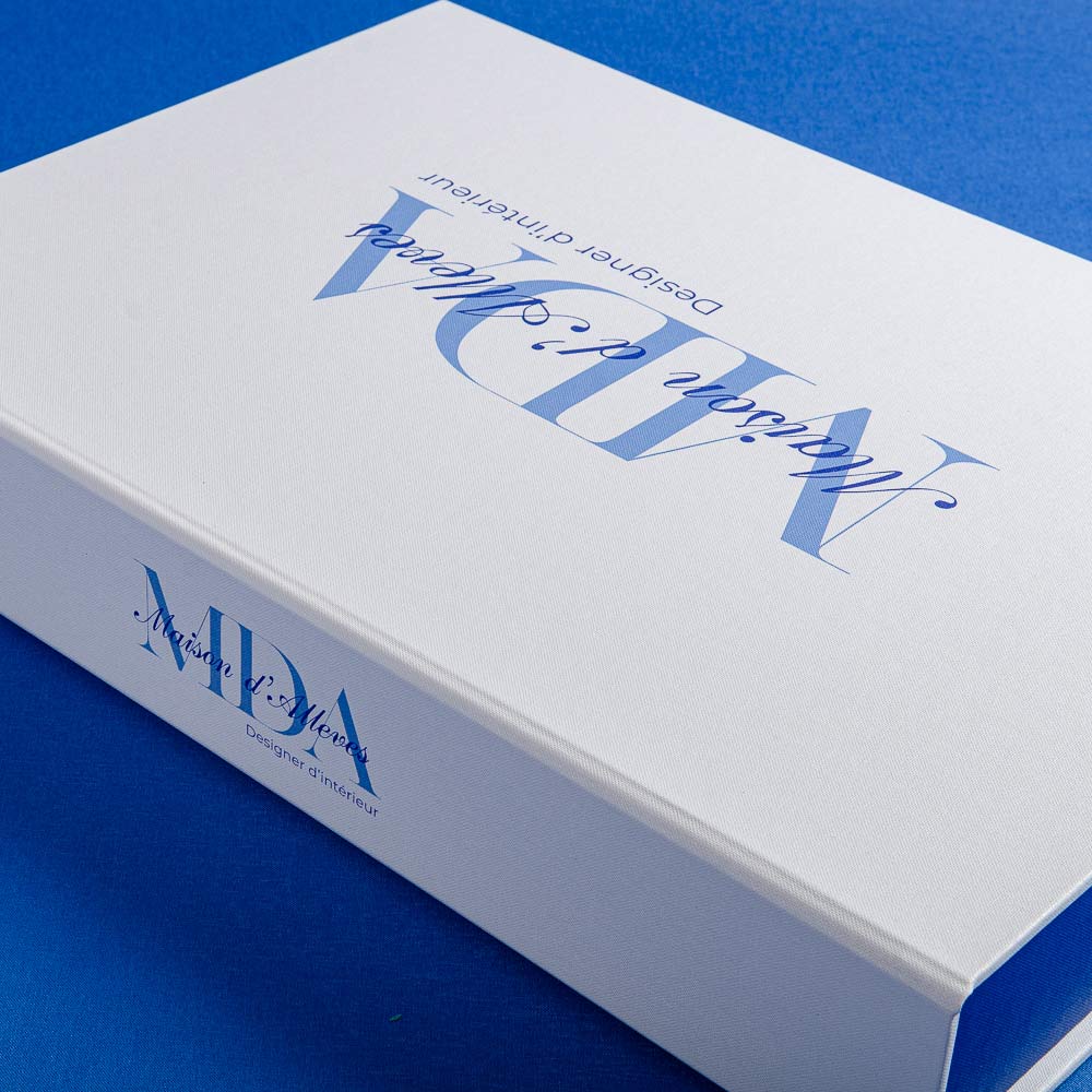 White clamshell box with blue text and logos on a blue background by hartnack and co - Gallery image 2