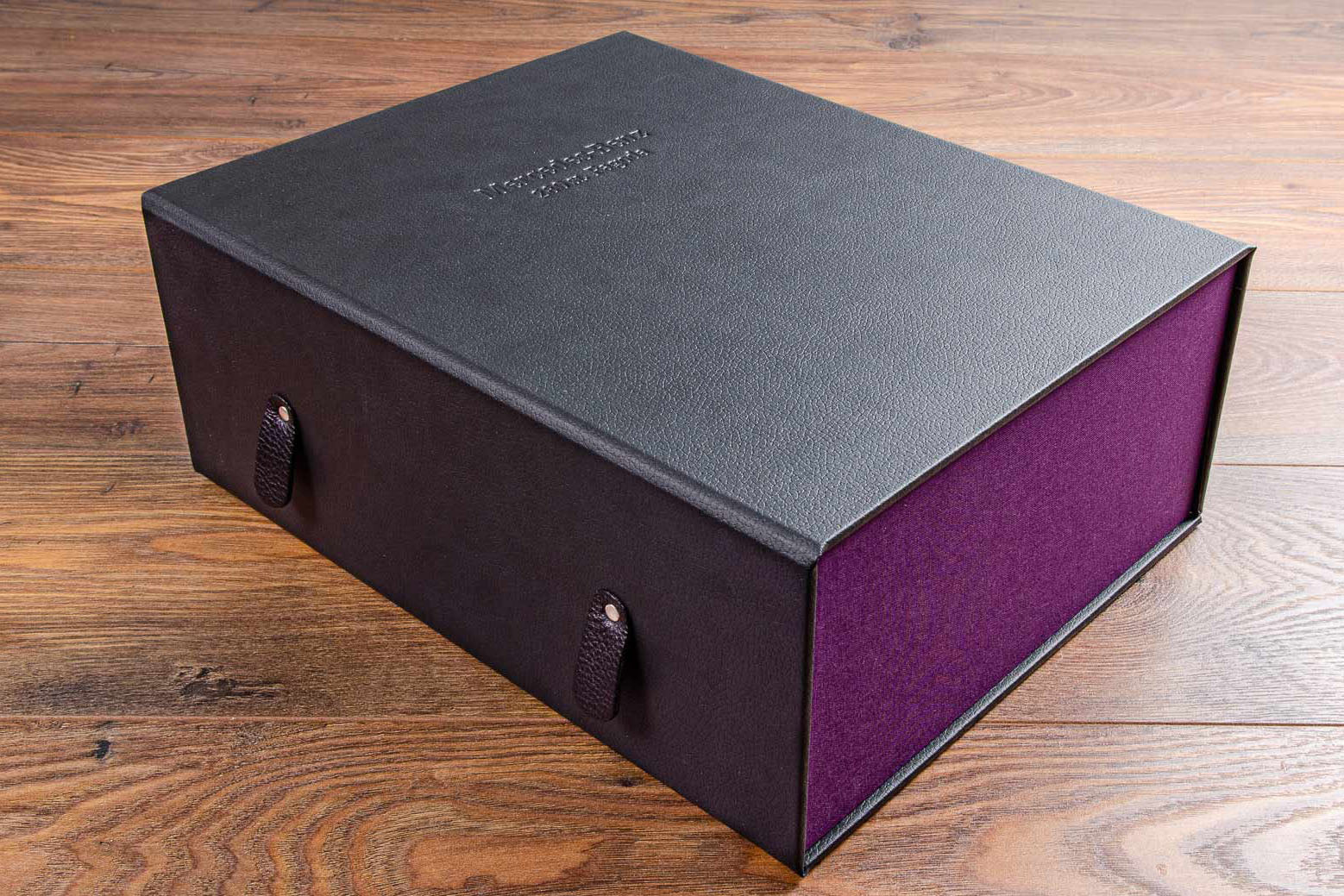 Customised vehicle document box with leather embossment on cover