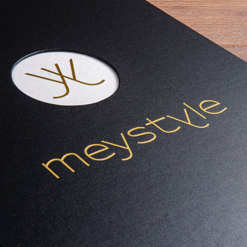 detail of gold foil personalisation on the cover of a presentation binder with a recessed window with gold foil embossed logo