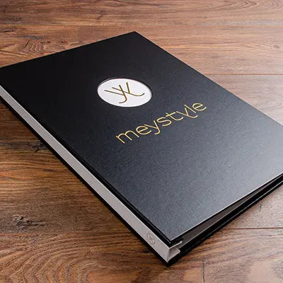 A3 portrait custom presentation binder in black buckram with gold foil personalisation on the cover and spine