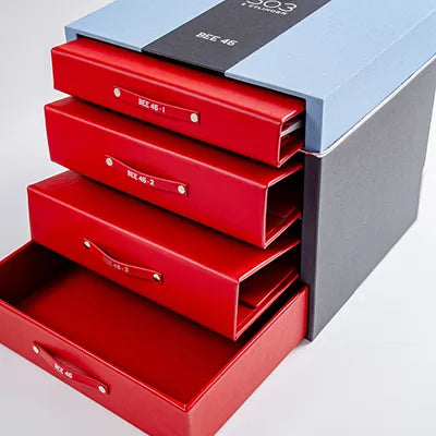 blue and black box with red binders and bmw 503 printed on top and car history folder 