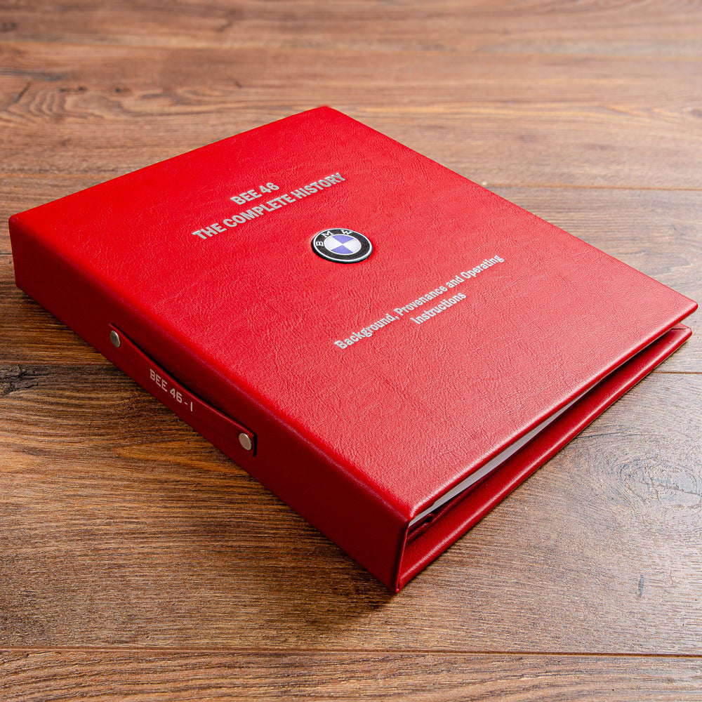 luxury red leather screw post binder with sliver embossed cover and bmw logo on the cover on brown background - Gallery image 2
