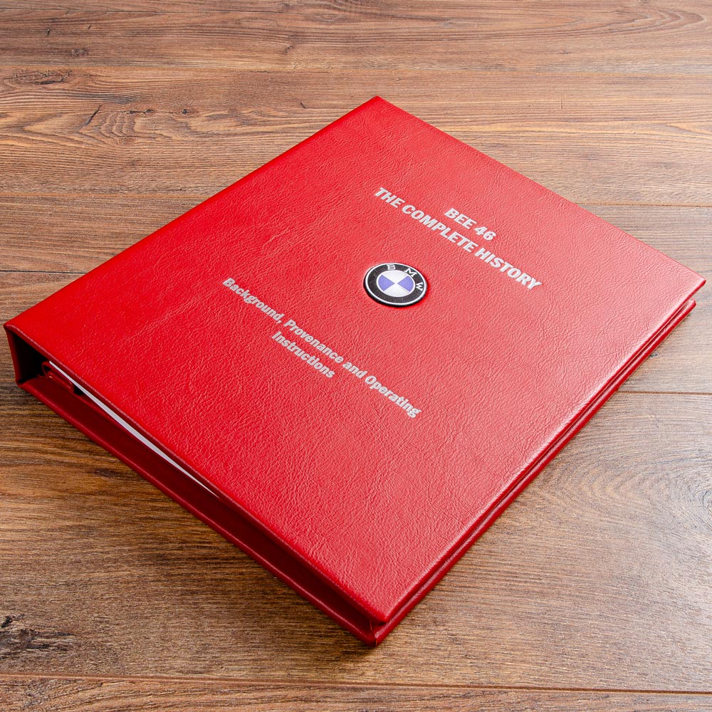 luxury red leather binder with silver foil personalised cover and bmw badge inserted into the cover - Gallery image 5