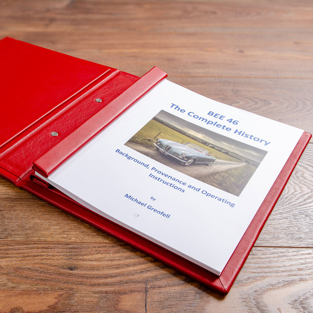 red car history binder with printed story of car on wooden floor - Gallery image 3