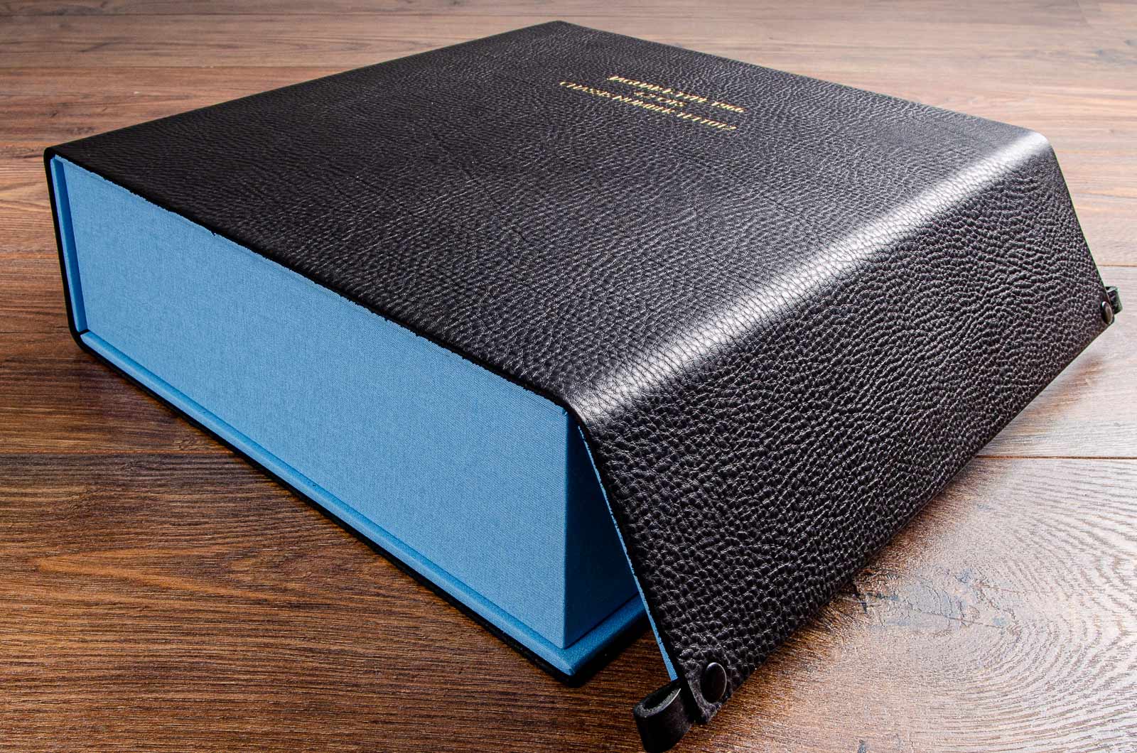 Black leather wrapped clamshell box with blue inlay 