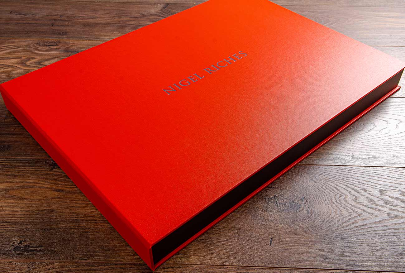 A2 clamshell photography portfolio box in Tangerine buckram with grey foil personalisation