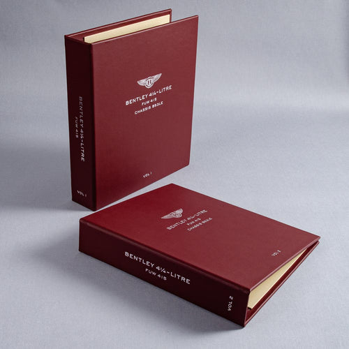 Two red leather Bentley ring binders custom made for car documents with personalised foil embossed covers