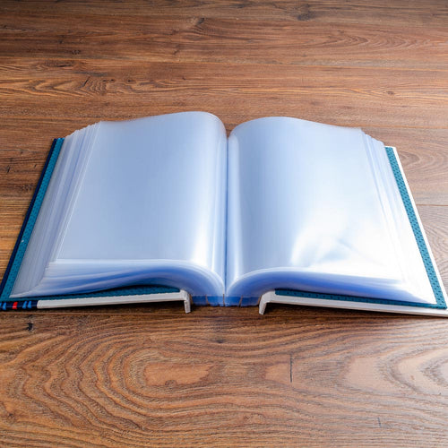 screw post binder lying open with 100 plastic page pocket inside