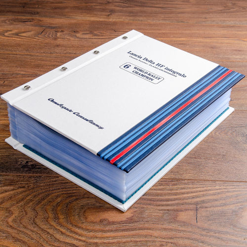 large custom made screw post binder for classic car documents in white buckram with blue strips and blue foil personalisation