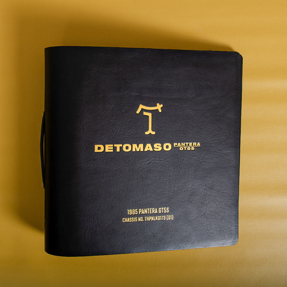 Black leather ring binder with gold foil text and logo on a yellow background - Gallery image 6
